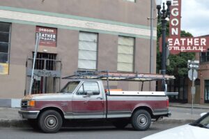 contractor work trucks and vans parked at an Arizona jobsite
