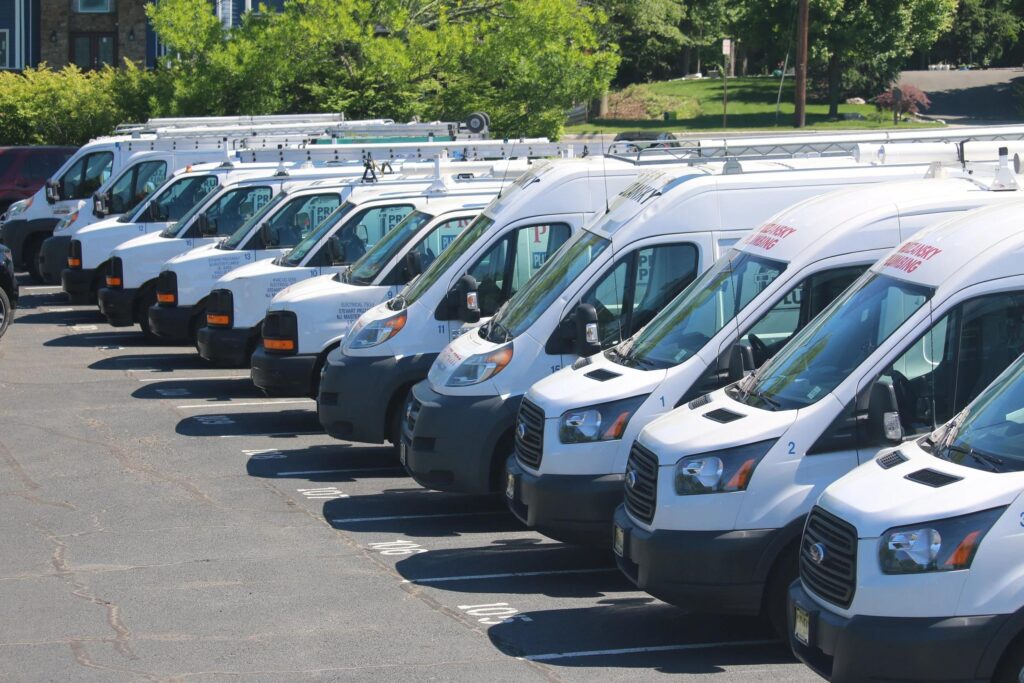 fleet of company service vans parked at a business