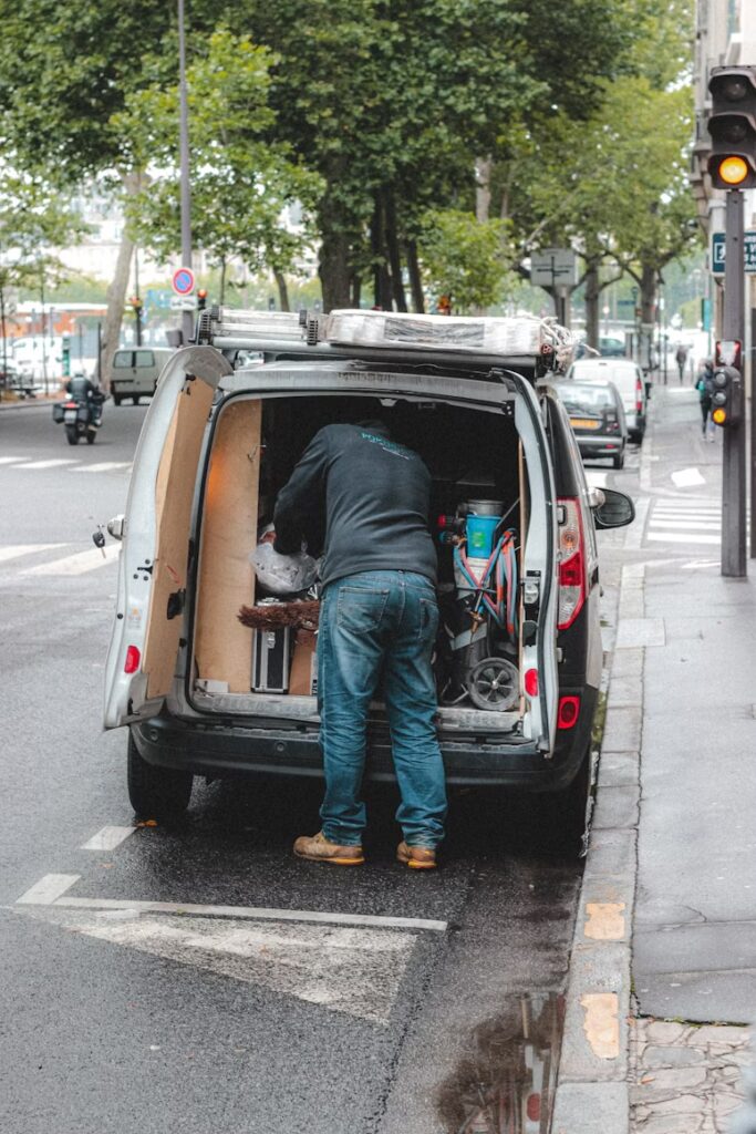 contractor accessing tools and equipment inside a service van